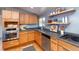 Modern kitchen with stainless steel appliances and light wood cabinets at 2590 S Meade St, Denver, CO 80219