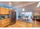 Open kitchen features stainless steel appliances and island at 2590 S Meade St, Denver, CO 80219