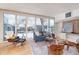 Living room with large windows and mid-century modern furniture at 2590 S Meade St, Denver, CO 80219