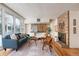 Mid-century modern living room with hardwood floors and brick fireplace at 2590 S Meade St, Denver, CO 80219