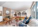 Spacious living room with hardwood floors, fireplace, and built-in shelving at 2590 S Meade St, Denver, CO 80219