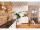 Living room detail featuring a brick fireplace and built-in cabinetry at 2590 S Meade St, Denver, CO 80219