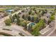 Aerial view of the community with lush landscaping, pool, and clubhouse amenities at 3845 Canyon Ranch Rd # 102, Highlands Ranch, CO 80126