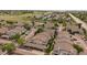 A beautiful aerial view of the condos nestled in a well-kept community with mature trees and landscaping at 3845 Canyon Ranch Rd # 102, Highlands Ranch, CO 80126