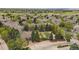Panoramic aerial view of the residential neighborhood, highlighting a community pool and clubhouse at 3845 Canyon Ranch Rd # 102, Highlands Ranch, CO 80126