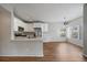 A bright kitchen featuring stone countertops, stainless steel appliances, and custom white cabinets at 3845 Canyon Ranch Rd # 102, Highlands Ranch, CO 80126