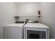 Bright laundry room featuring modern appliances and storage shelving at 3845 Canyon Ranch Rd # 102, Highlands Ranch, CO 80126