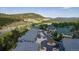 Scenic aerial view of a townhome community with mountain views, surrounded by lush greenery and easily accessible highways at 31112 Black Eagle Dr # 101, Evergreen, CO 80439