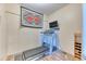 Finished basement with treadmill, entertainment center, and carpet at 31112 Black Eagle Dr # 101, Evergreen, CO 80439