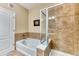 Bathroom featuring tub, shower with glass partition, and tile flooring at 31112 Black Eagle Dr # 101, Evergreen, CO 80439