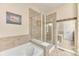 Bathroom featuring tub and shower separated by a glass divider at 31112 Black Eagle Dr # 101, Evergreen, CO 80439
