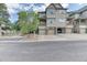 Inviting townhome featuring an attached garage and charming, covered balcony with lovely stone accents at 31112 Black Eagle Dr # 101, Evergreen, CO 80439