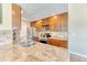 Well-equipped kitchen with granite countertops and stainless-steel appliances at 31112 Black Eagle Dr # 101, Evergreen, CO 80439