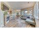 Bright living area with fireplace and open layout to kitchen and dining at 31112 Black Eagle Dr # 101, Evergreen, CO 80439