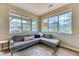 Cozy living room corner with ample natural light and comfortable seating at 31112 Black Eagle Dr # 101, Evergreen, CO 80439