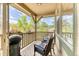 Covered porch featuring furniture and grill with mountain view at 31112 Black Eagle Dr # 101, Evergreen, CO 80439