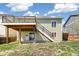 The spacious backyard features a multi-level deck, perfect for entertaining or relaxing at 19804 E Villanova Pl, Aurora, CO 80013