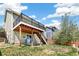 A spacious two-level deck overlooks the backyard, offering seamless indoor-outdoor living at 19804 E Villanova Pl, Aurora, CO 80013