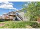 A spacious two-level deck overlooks the backyard, offering seamless indoor-outdoor living at 19804 E Villanova Pl, Aurora, CO 80013