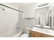 A bathroom with a vanity, toilet, shower and tub combination, and natural light at 19804 E Villanova Pl, Aurora, CO 80013