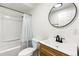 Bright bathroom featuring a tub with shower, toilet, and a modern sink with vanity at 19804 E Villanova Pl, Aurora, CO 80013