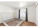 Bright bedroom with carpet, a large window, and an awaiting bed frame to create your retreat at 19804 E Villanova Pl, Aurora, CO 80013