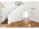 Entryway leading to stairs and an open living space with hardwood flooring at 19804 E Villanova Pl, Aurora, CO 80013