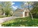 Charming home with a green lawn, driveway, garage, and front yard at 19804 E Villanova Pl, Aurora, CO 80013