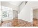 Inviting living room with lots of light, wood floors, and vaulted ceilings at 19804 E Villanova Pl, Aurora, CO 80013