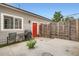 Backyard patio area with a small table and chair at 4728 S Acoma St, Englewood, CO 80110