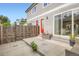 Fenced backyard with a small patio area and access to the house through a sliding glass door at 4728 S Acoma St, Englewood, CO 80110