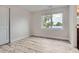 Empty bedroom with hardwood floors, a large window and closet at 4728 S Acoma St, Englewood, CO 80110