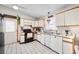 Functional kitchen with white cabinetry, essential appliances, and a practical layout at 59 S De Gaulle St, Aurora, CO 80018