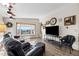 Cozy living room with a bay window providing natural light and comfortable seating at 59 S De Gaulle St, Aurora, CO 80018