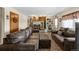 Spacious living room with large, comfortable leather sofas, a white fireplace, and tile floors at 59 S De Gaulle St, Aurora, CO 80018