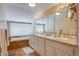 Luxurious bathroom with double sinks, large mirrors, and a soaking tub at 199 Lafayette St, Denver, CO 80218