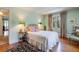 Cozy bedroom with hardwood floors, antique furnishings, and lots of natural light from a window at 199 Lafayette St, Denver, CO 80218