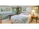 Bedroom with green walls and two windows with a full size bed at 199 Lafayette St, Denver, CO 80218