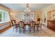 Formal dining room with chandelier, wooden table, and cushioned chairs at 199 Lafayette St, Denver, CO 80218