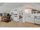 Multi-use room includes a desk area, kitchenette, and doorway to another living space at 199 Lafayette St, Denver, CO 80218
