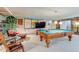 A pool table highlights this game room and finished basement with a seating area at 199 Lafayette St, Denver, CO 80218