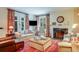 Comfortable living room with fireplace, large windows, plush seating, and colorful accents at 199 Lafayette St, Denver, CO 80218