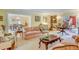 Cozy living room flows into the formal dining room; a delightful space for entertaining or relaxing at 199 Lafayette St, Denver, CO 80218