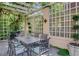Outdoor dining area featuring a lattice-covered patio and seating for six guests at 199 Lafayette St, Denver, CO 80218