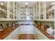 Butler's pantry features abundant shelving, storage, glass cabinets, and wooden countertops at 199 Lafayette St, Denver, CO 80218