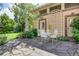 Charming stone patio with outdoor seating, a decorative trellis, and lush greenery, perfect for relaxing and entertaining at 199 Lafayette St, Denver, CO 80218