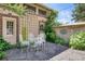 Charming patio area with stone pavers, decorative trellis, and elegant outdoor seating, perfect for enjoying the serene surroundings at 199 Lafayette St, Denver, CO 80218