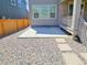 Paved backyard area with stepping stones, and a wooden fence, perfect for outdoor enjoyment and low-maintenance landscaping at 656 N Bersshine St, Watkins, CO 80137