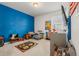 Colorful room with blue accent wall and cozy carpet, perfect for playtime at 656 N Bersshine St, Watkins, CO 80137