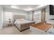Bright bedroom features a tray ceiling, plush carpet, and lots of natural light at 656 N Bersshine St, Watkins, CO 80137